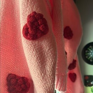 Pink Sweater with Red Knit Accents